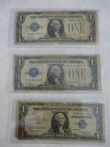 lot 30 image: 3- One Dollar Silver Certificates, 2-1928 and 1-1935 NOTE- 3 X Money