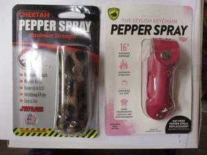 lot 140 image: 2-NEW-PEPPER SPRAYS, 1-GUARD DOG-THE STYLISH KEY CHAIN-PINK AND 1-CHEETAH- SNAKESKIN DESIGN, 2X MONEY