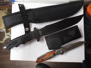 lot 166 image: 2-Knifes, 1-SURVIVOR HK- 718 Hunting Knife In Sheath And 1- DoomBlade-Switchblade With Belt Clip And Sheath  2-X Money