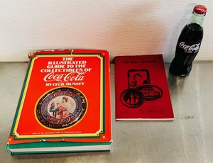 lot 39 image: The Illustrated Guide of Coca-Cola Collectibles, Guide to Soda Water Advertising and Unopened 7-11 75 Years of Convenience 1927-2002 Coca-Cola Bottle&nbsp