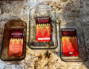 lot 174 image: 3 Vintage (New) Ovenproof Fire-King Bakeware by Anchor Hocking - #432 (10x6x2) - #441 (Loaf Dish 1Qt) - #427 (Amber 15pt Utility Dish)