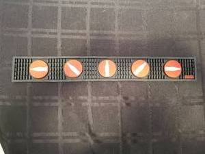 lot 124 image: Coca Cola rubber bardrink mat - 3.5 by 22 - Qty of 2