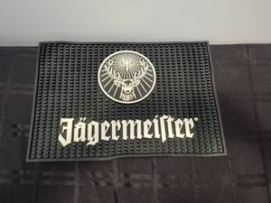 lot 134 image: Jgermeister rubber bardrink mat - 12 by 18 - Qty of 2
