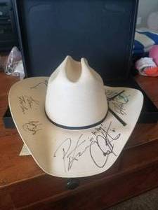 lot 118 image: Cowboy Resistol hat with autographs - believe 3 of them to be Pat Green, Kevin Fowler, and Roger Creag, not sure about the rest