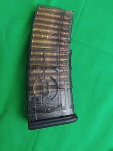 lot 37 image: 30 ROUND CLIP FOR 5.56X45 OR 7.62X35 AND 29 ROUNDS IN IT