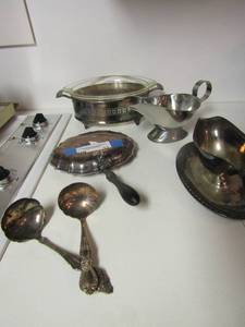 lot 11 image: 1881 Wm. Rogers Oneida ladle x 2, Silver plate Round casserole dish by glass bake, gravy boat x 2 