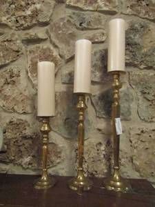 lot 19 image: 3 brass candle holders  11 14 and 18 with 3 NEW candles