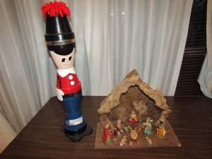 lot 24 image: Nut Cracker 22x4x6 and 11x14 x7 wooden nativity