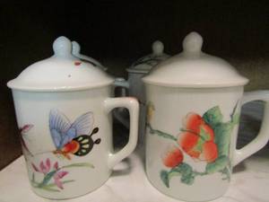 lot 33 image: 3 brown HAND BLOWN glass coffee cups  2 mini S&P shakers, 4 covered tea cups individual bird design