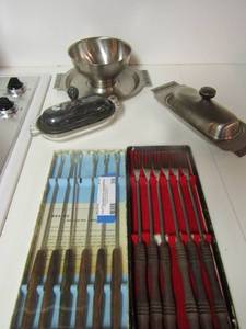 lot 39 image: Stainless 18.8 covered butter dish, soup dish on tray, footed butter dish with stainless top, 2 NEW packs of fondue forks