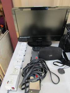 lot 97 image: 20 Vizio TV with remote. 1 Polk speaker and 2 surg protector strips