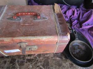 lot 105 image: Kitchen lot- small cast iron skillets, brown leather lock box full of flatwear,  utensils, hand mixer and more
