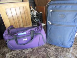 lot 113 image: Rolling Blue and purple suitcases