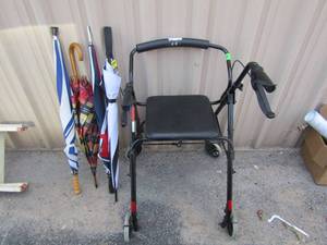 lot 123 image: L 4 wheel walker with seat and storage & assorted umbrellas
