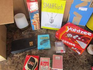 lot 133 image: Box o games- Lots of playing cards, poker chips, Poker chips,  Uno, Skip Bo, dominoes and more