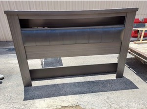 lot 107 image: Black padded King headboard with 1 tier storage space