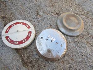 lot 382 image: 3 vintage ford hub caps