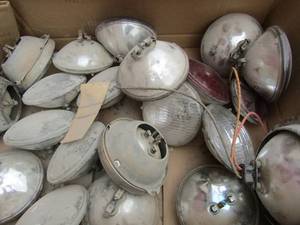 lot 827 image: box of 12v 50w dot headlamp 1979