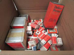 lot 46 image: Mixed Box of autolite brush sets 11-6, Delco remy condensers F-202, Delco Remy brush sets- #10-1857963