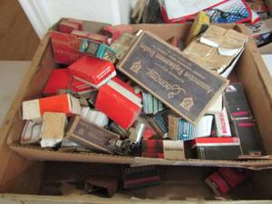 lot 116 image: Box full of various ignition switches, tungsten UC-108H-- Colt ignitions #EY2433-- Ampco ignition #AL531-- economy replacement brushes FX-9