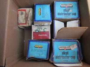 lot 20 image: Western auto distributor Caps, for a ford 6 cycle years 1949-1974 Part # 64-4220-6 qty 7