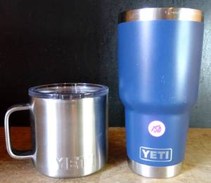 lot 150 image: LOT OF YETI DRINKWARE - COFFEE CUP WITH SIP LID & ADVERTIZEMENT TUMBLER $$