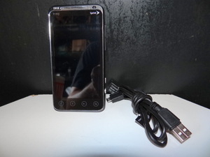 lot 306 image: HTC EVO PHONE WITH CHARGING CABLE