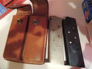 lot 1022 image: COLT 45 CLIPS X 2 IN A LEATHER CASE
