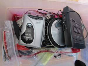 lot 41 image: Tote full of walkman hand held AMFM radios and CD player