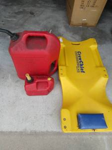 lot 48 image: Crew chief car roller  and 1 gal. and 5 gal gas cans