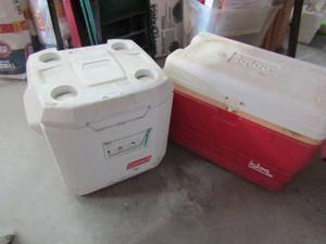 lot 55 image: White Coleman rolling Ice chest and red Igloo ice chest
