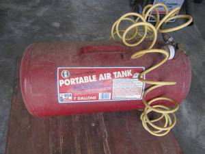 lot 62 image: Midwest portable 7 gallon air tank with hose