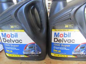lot 85 image: 4 new bottles of MOBIL DELVAC 15W-40 diesel oil 1 gal each