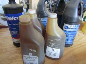 lot 86 image: 1 used DELCO axel lubricant 3 new bottlesGM Synthetic axel lubricant 75w-140