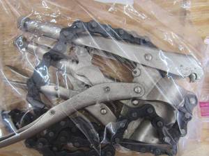 lot 129 image: Chainsaw chain and chain plyers