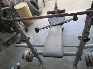 lot 166 image: Weider bench press with bar foot pull