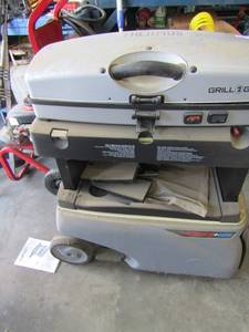 lot 171 image: Thermous grill to go fire and Ice grill and cooler on wheels (propane)