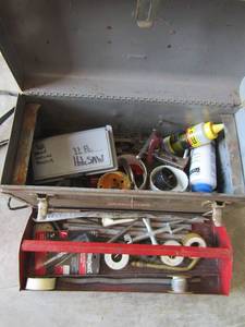 lot 218 image: 11 piece hacksaw, plum balls, chalk box, plumber tape, pipe compound seal pull all in gray toolbox