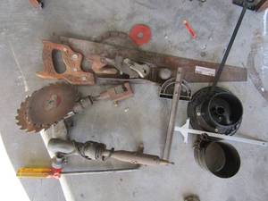 lot 230 image: Misc. tool lot- saw blades, hand saws, level,soldering gun
