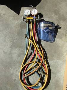lot 235 image: Yellow jacket test and charging manifold and face mask