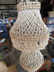 lot 240 image: White and tan seashell hanger with box of new votive candles