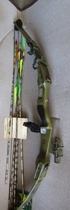 lot 268 image: Black Bow by Bear Excellent condition-7 arrows, field points. Draw weight 55 lbs. in case