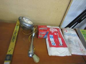 lot 318 image: Vacume cleaner bags, car light, trim to fit window  AC unit