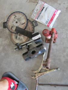 lot 390 image: 25 foot metal hanger strap saw blades. 2 ton bottle jack vice grips and sledge hammer head