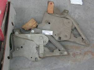 lot 415 image: Dodge hood brackets x 2