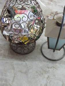 lot 527 image: Outside lantern on stand and large metal wire design basket full of matches