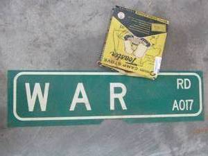 lot 637 image: Camp stove toaster and War road street sign