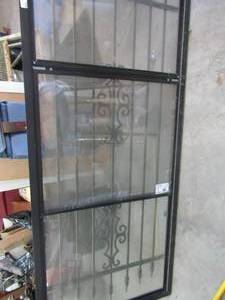 lot 734 image: Storm glass door 75x36