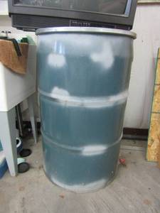 lot 775 image: Empty 50 gallon metal barrel