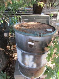 lot 817 image: Charbroil propane grill 50 gallon drum of old oil